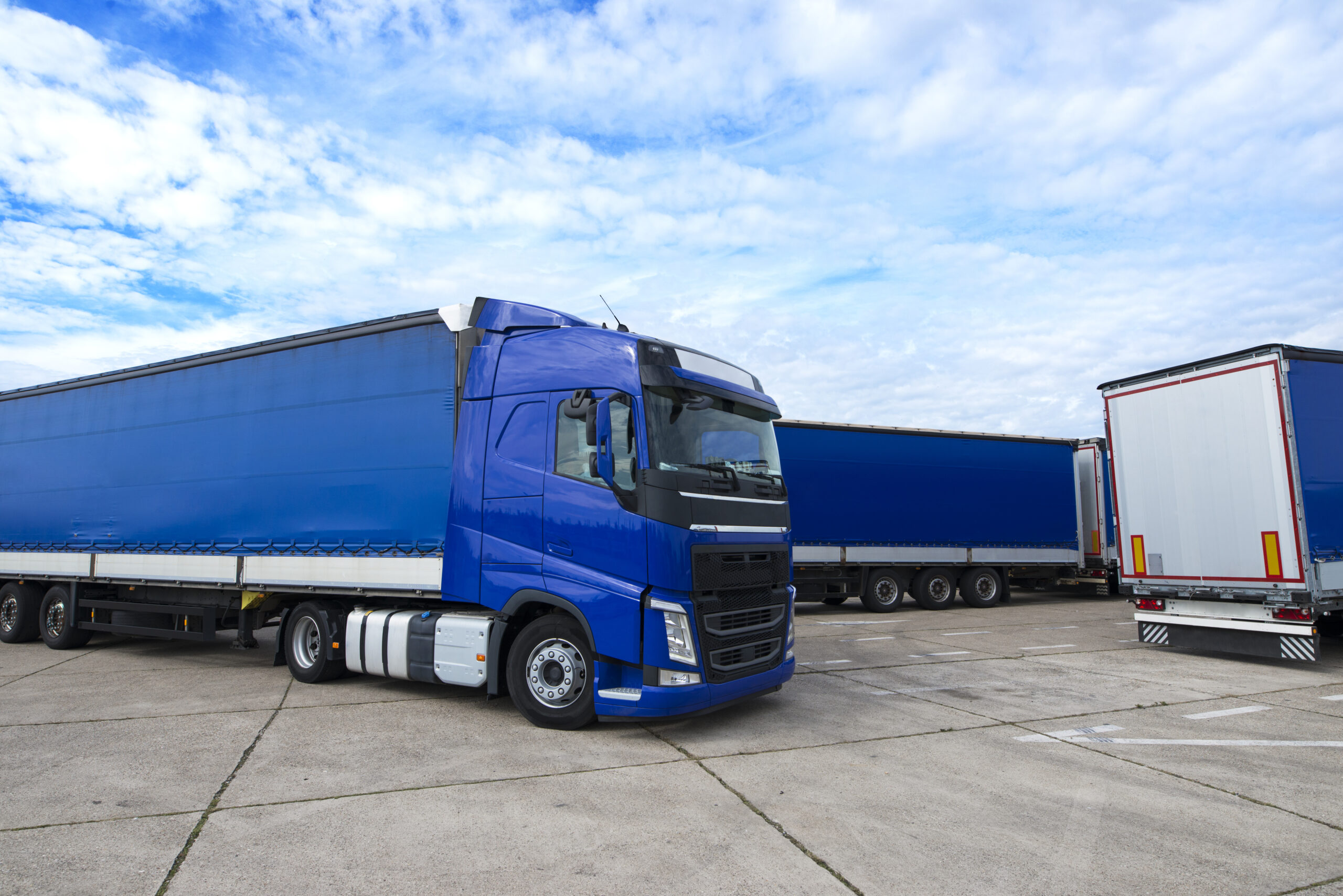 Truck vehicle with trailers in background. Truck vehicle with trailers in background.